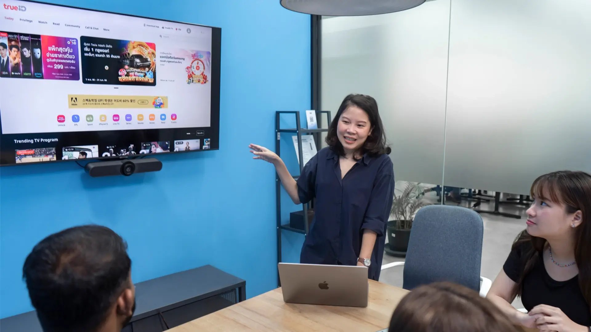 Seven Peaks team member presenting the TrueID website interface during a project meeting.